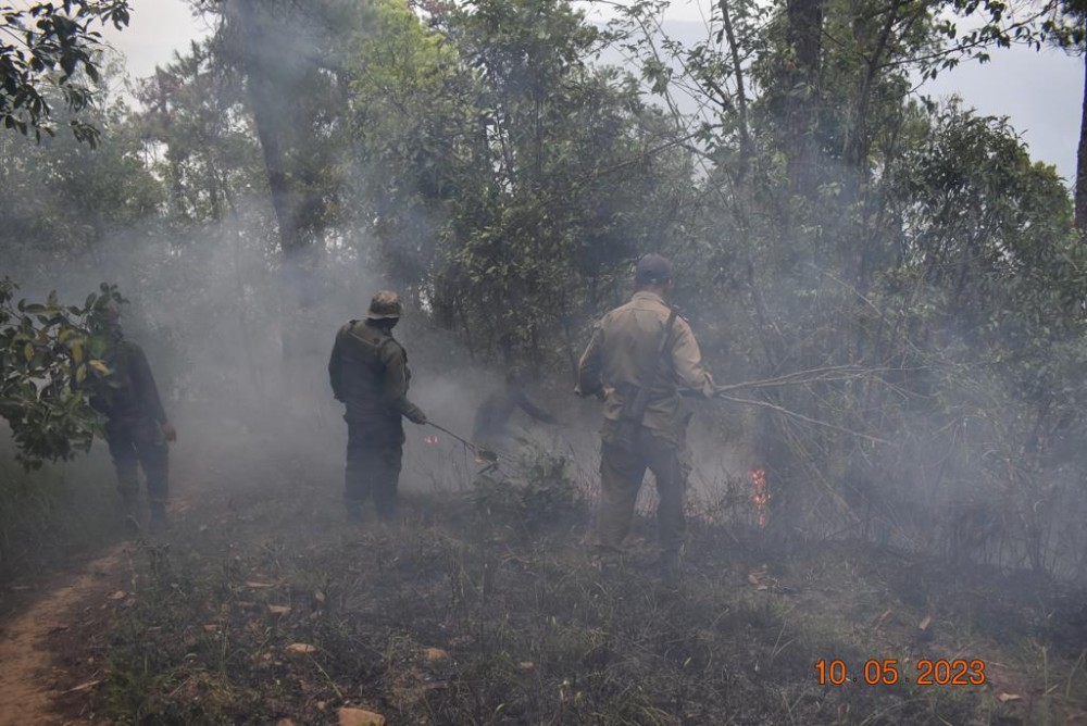 Assam Rifles personnel are seen dousing a forest fire that broke out between villages Waphar and Shamator village on May 10. (Photo Courtesy: PRO HQ IGAR-N)